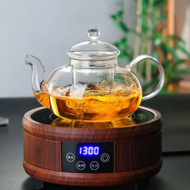 Théière en verre transparent de 400 ml avec infuseur, compatible avec les plaques de cuisson. Résistante à la chaleur.