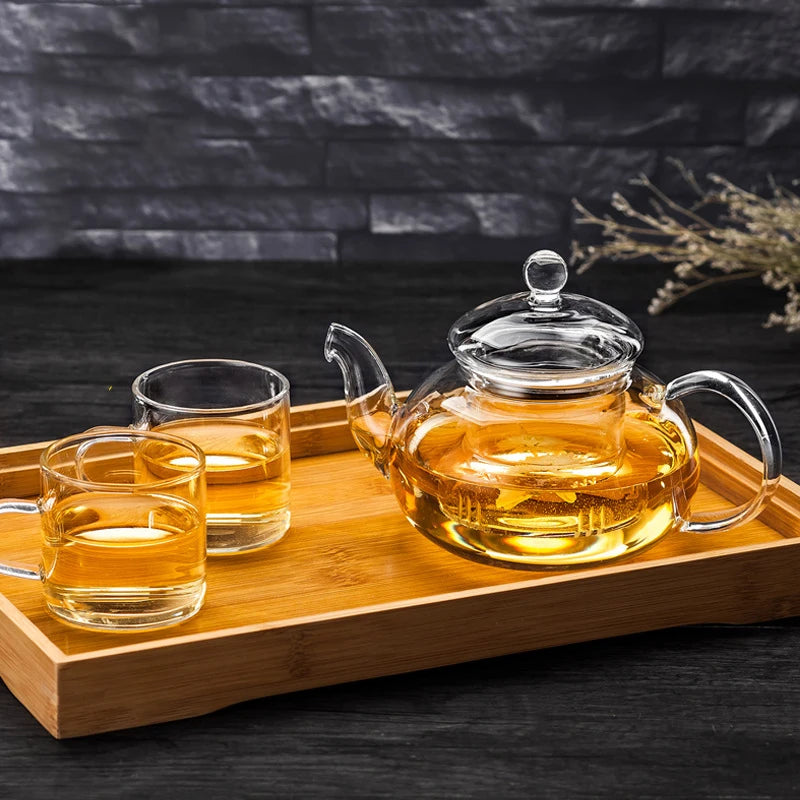 Théière en verre transparent de 400 ml avec infuseur, compatible avec les plaques de cuisson. Résistante à la chaleur.